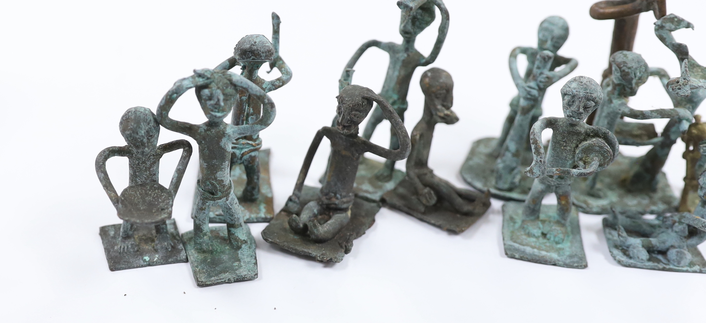 A collection of 20th century West African bronze figures, possibly gold weights, Ghana, Akan, box inscribed ‘West Africa. Gold Coast - attained in 1944 (Ghana)’, tallest 8.5cm